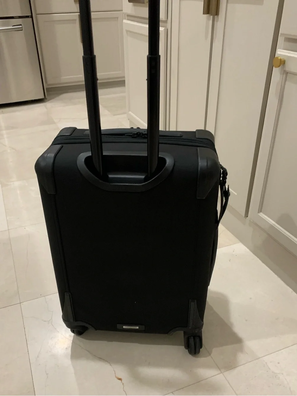 Tumi Black Spinner Carry-On with Front Zip Pocket luggage